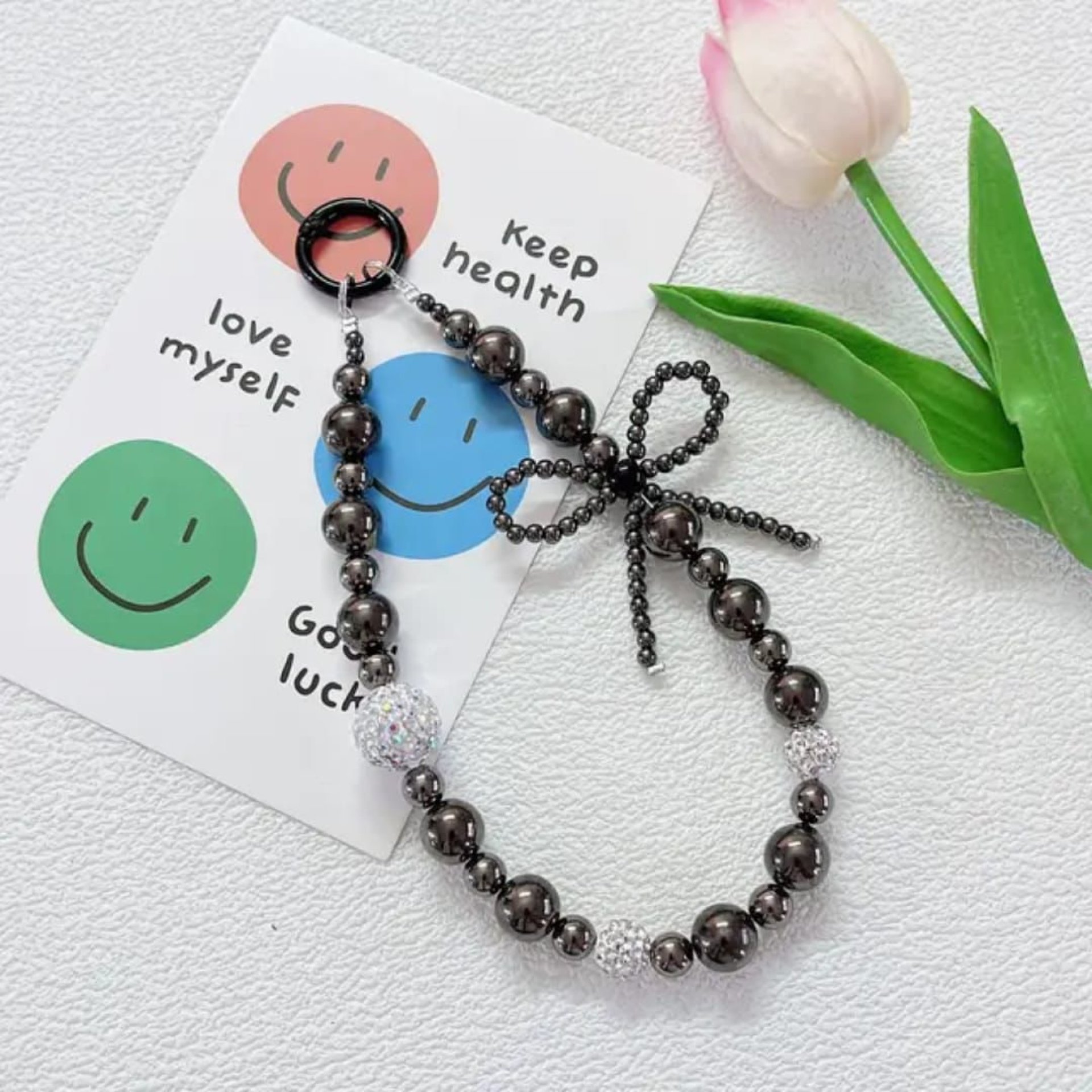 Midnight Bow – Black Beaded Phone Charm ✨